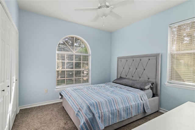 bedroom featuring a closet, ceiling fan, and carpet flooring