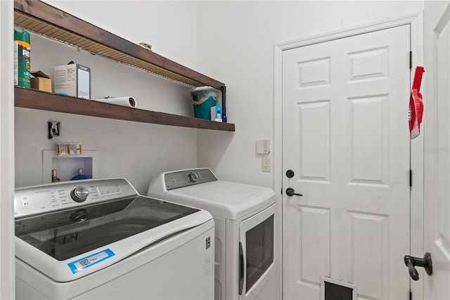 laundry room with separate washer and dryer