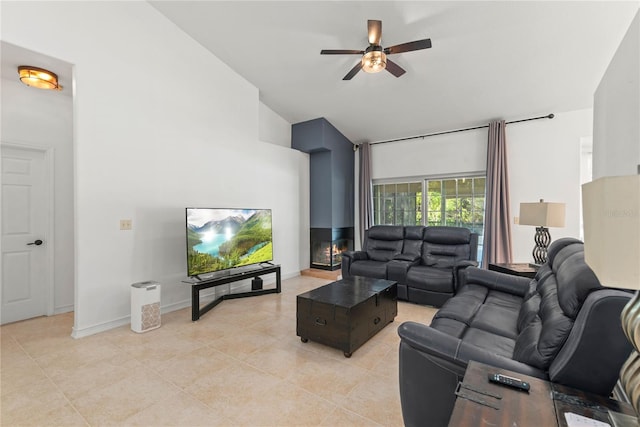 tiled living room featuring ceiling fan