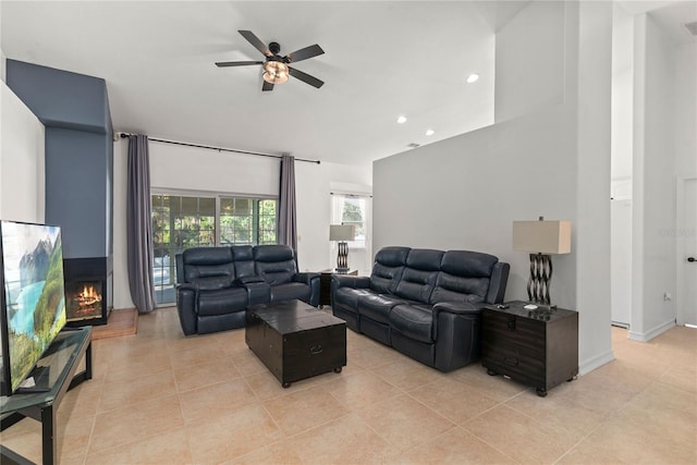 tiled living room with ceiling fan