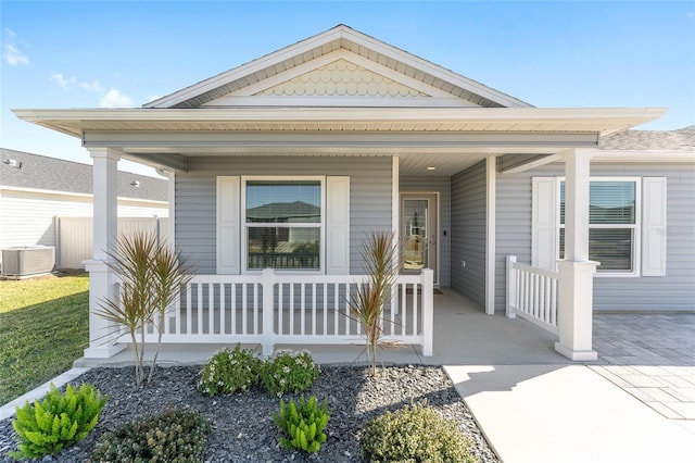 view of front of home featuring a porch and central AC unit