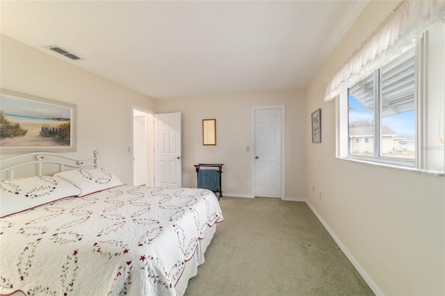 bedroom featuring light colored carpet