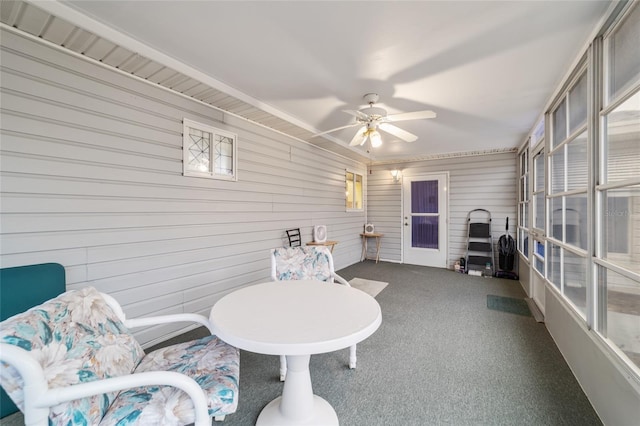 sunroom with ceiling fan