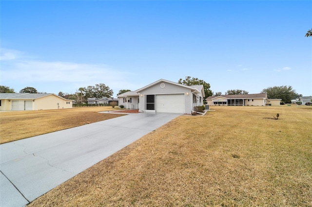 ranch-style home with a garage and a front lawn