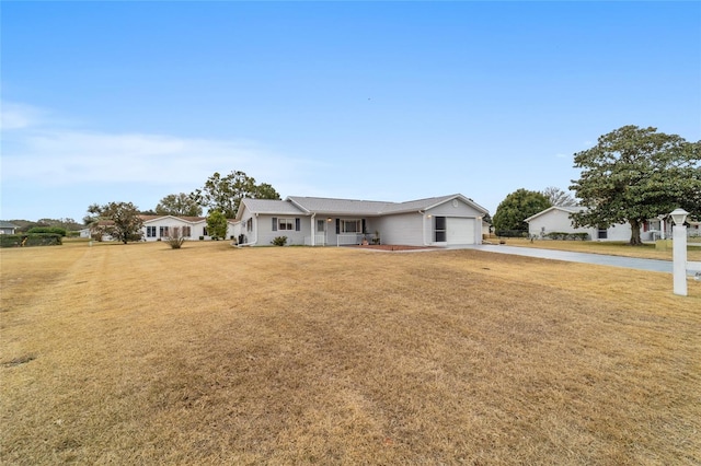 single story home with a garage and a front yard