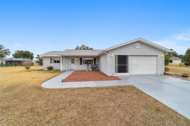 ranch-style house with a garage, covered porch, and a front yard