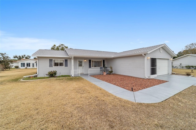 single story home featuring a garage, a front yard, and covered porch