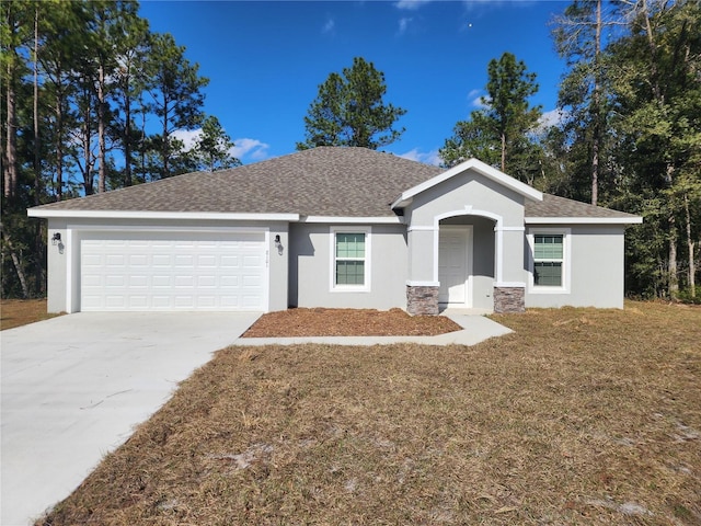 single story home with a garage and a front yard