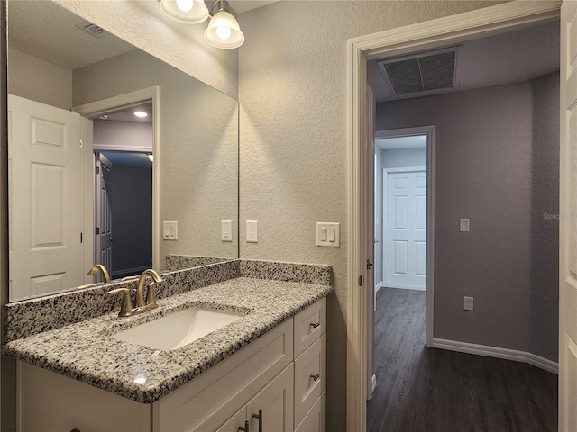 bathroom featuring wood-type flooring and vanity