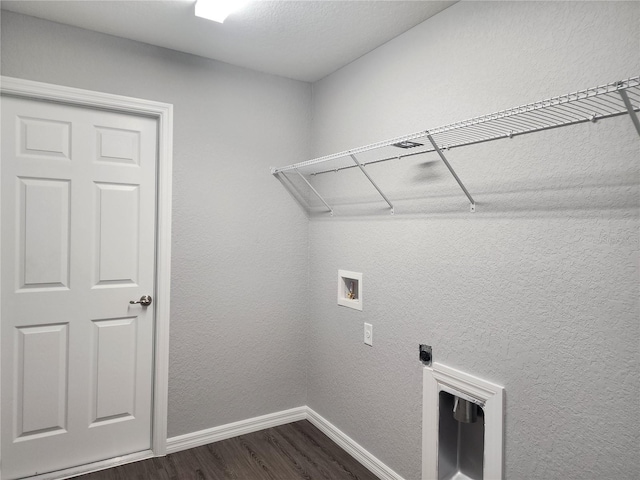 washroom with hookup for a washing machine and dark hardwood / wood-style flooring