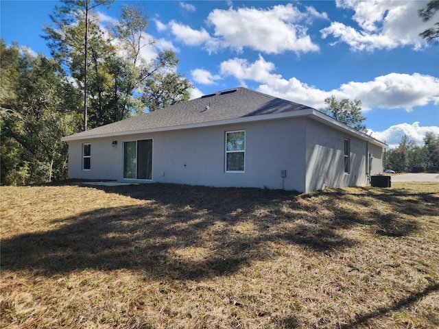 back of house with a yard