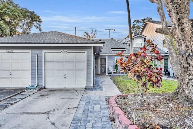 view of front of property with a garage