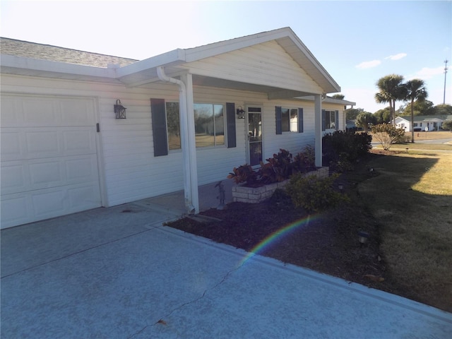 ranch-style house featuring a garage