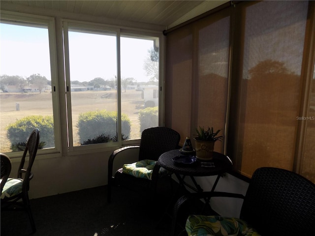 sunroom / solarium with a rural view