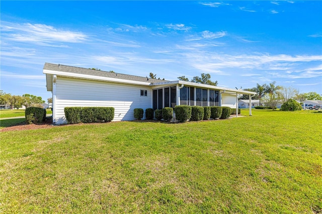17664 SE 105th Ter, Summerfield, FL 34491 - rear view of property featuring a sunroom, a garage, and a yard