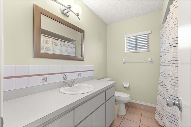 17664 SE 105th Ter, Summerfield, FL 34491 - bathroom featuring vanity, toilet, a textured ceiling, tile patterned flooring, and baseboards