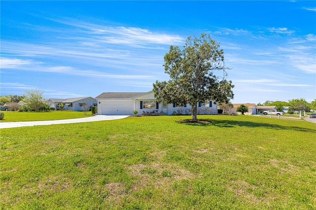 17664 SE 105th Ter, Summerfield, FL 34491 - view of front facade featuring concrete driveway, a front lawn, and an attached garage