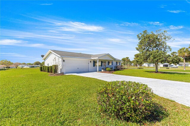 17664 SE 105th Ter, Summerfield, FL 34491 - ranch-style house with a garage, a front lawn, and concrete driveway