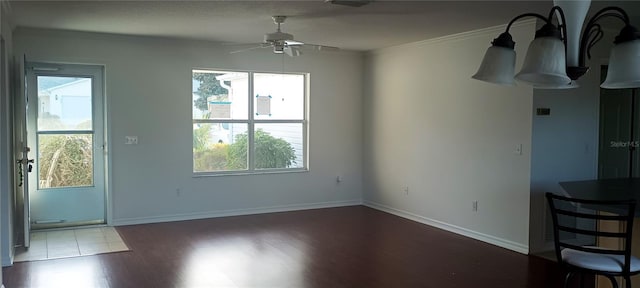 unfurnished living room with wood-type flooring, crown molding, and ceiling fan