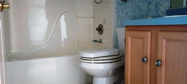 bathroom with shower / bath combination and toilet