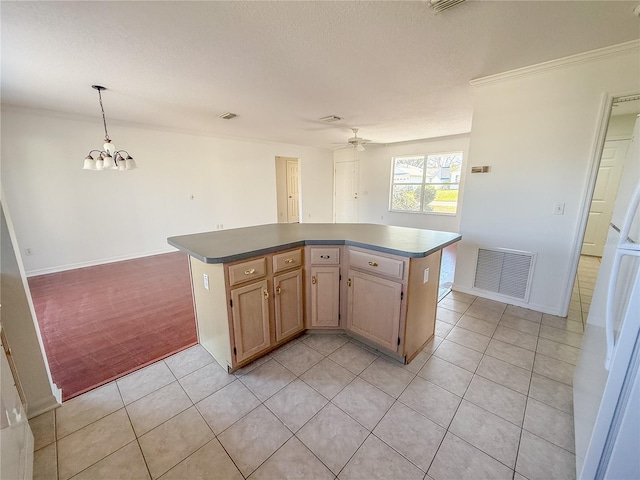 kitchen featuring light tile patterned floors, visible vents, open floor plan, decorative light fixtures, and a center island