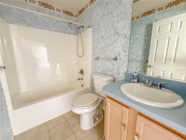 bathroom featuring tile patterned flooring, toilet, vanity,  shower combination, and wallpapered walls