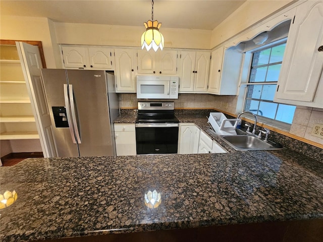 kitchen featuring sink, electric range oven, white cabinets, stainless steel fridge with ice dispenser, and decorative backsplash