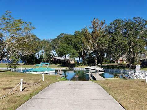 view of property's community featuring a water view and a yard