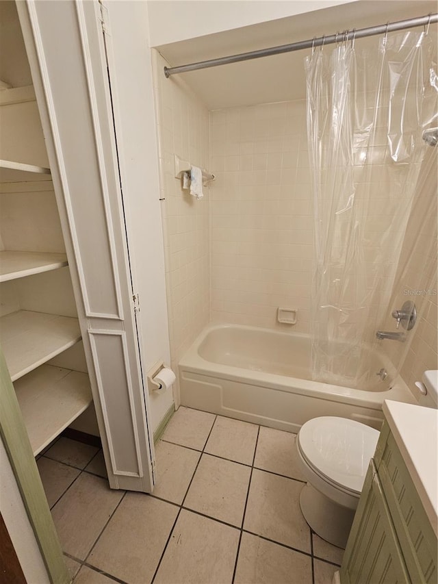 full bathroom with tile patterned flooring, vanity, shower / bathtub combination with curtain, and toilet