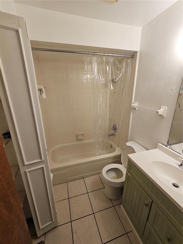 full bathroom featuring vanity, tile patterned floors, toilet, and shower / bath combo