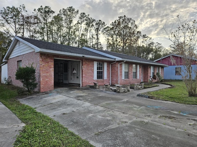 ranch-style home featuring a garage