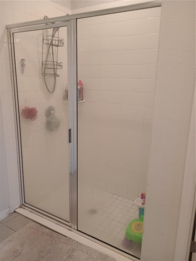 bathroom featuring tile patterned floors and walk in shower