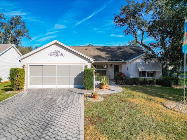 ranch-style home with a garage and a front yard