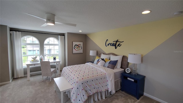 bedroom with vaulted ceiling, a textured ceiling, and ceiling fan