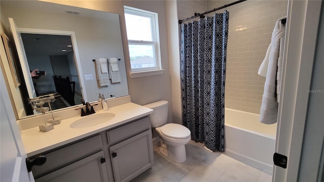 full bathroom featuring tile patterned floors, vanity, toilet, and shower / bath combo