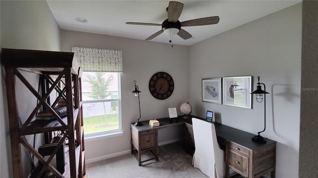 carpeted office with ceiling fan