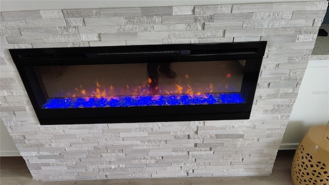 room details featuring a stone fireplace