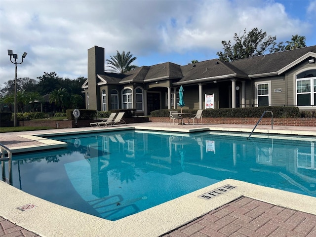 view of swimming pool featuring a patio area