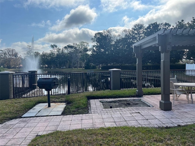 view of patio / terrace with a water view