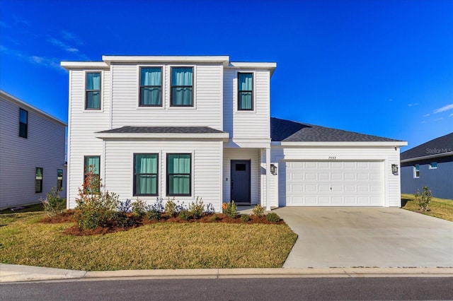 front of property featuring a garage and a front lawn