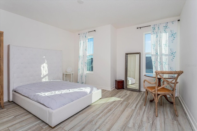 bedroom with light hardwood / wood-style flooring