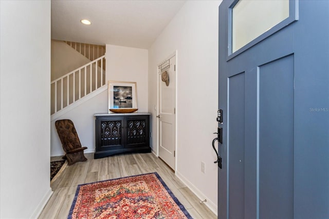 entryway with light hardwood / wood-style flooring