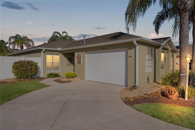 ranch-style home with a garage