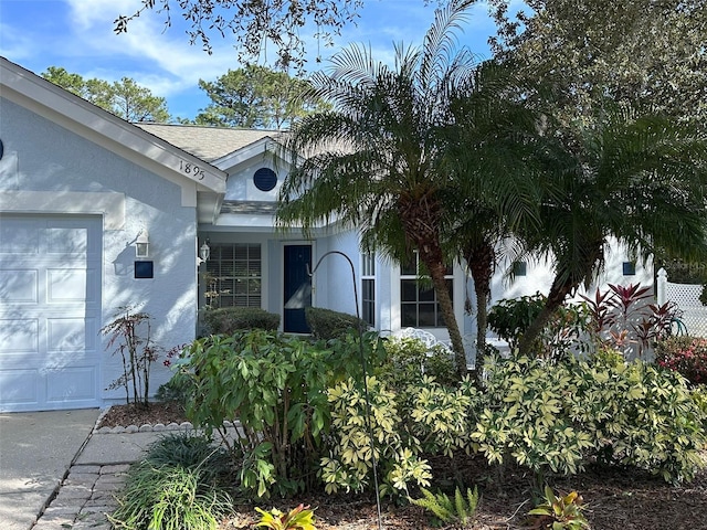 view of exterior entry with a garage