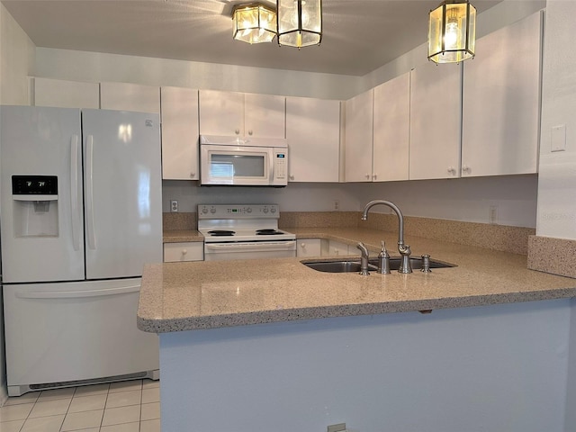 kitchen featuring sink, kitchen peninsula, pendant lighting, white appliances, and light stone countertops