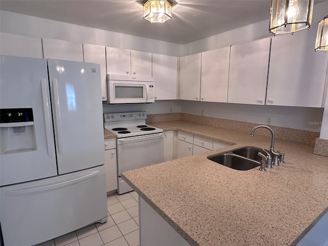 kitchen with pendant lighting, sink, white appliances, white cabinetry, and light stone counters