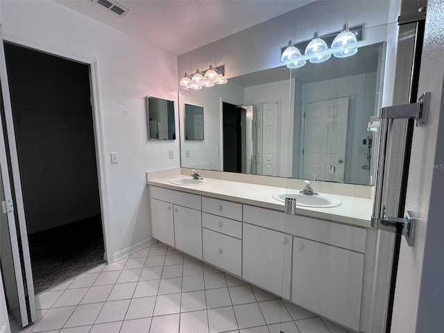 bathroom featuring vanity and tile patterned flooring