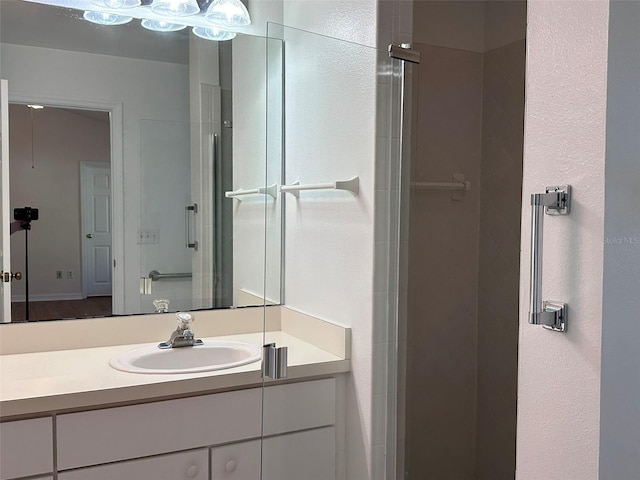 bathroom with vanity and an enclosed shower