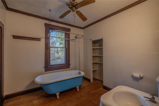 bathroom featuring wood-type flooring, sink, a washtub, ceiling fan, and crown molding