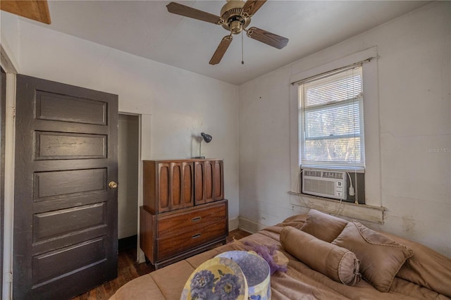 bedroom with dark wood-type flooring, cooling unit, and ceiling fan